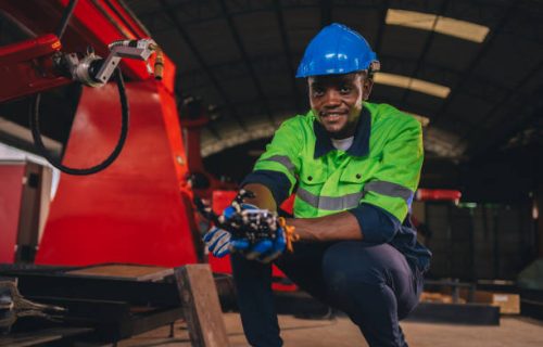 istockphoto-1817938110-612x612 Young engineer works diligently in advanced robot welding factory in modern technology world.